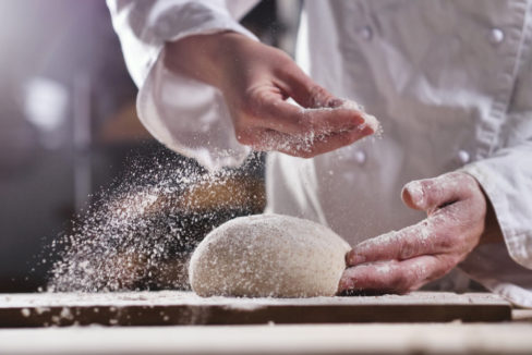 An,Experienced,Chef,In,A,Professional,Kitchen,Prepares,The,Dough