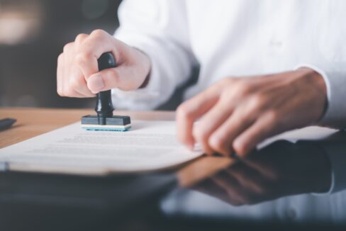 Businessman,Validates,And,Manages,Business,Documents,And,Agreements,,Signing,A